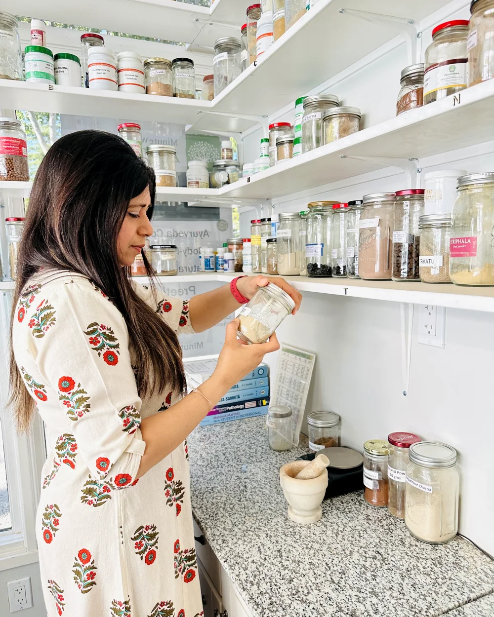 Preeti Gupta with herbs and oils at the Minute Wonder Ayurveda clinic in San Ramon